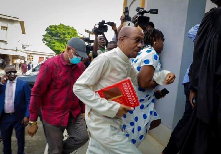 Extras Emefiele Arrives Court with Bible Tucked Under His Arm Godwin Emefiele the Suspended Central Bank of Nigeria cbn Governor Was on Tuesday Arraigned at the Federal High Court Sitting in Ikoyi Lagos on Two Godwin Emefiele the Suspended Central Bank of Nigeria cbn Governor Was on Tuesday Arraigned at the Federal High Court Sitting in Ikoyi Lagos on Two
