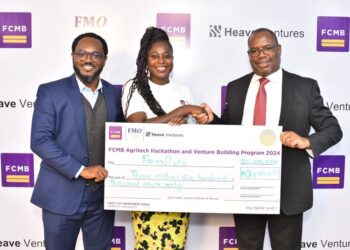 Head, Agribusiness & Structured Trade Commodity Finance, First City Monument Bank (FCMB), Mr. Daniel Olorunsuyi; Winner of the FCMB Agritech Hackathon, Ifeoluwa Olatayo of FarmSlate and Divisional Head, Agribusiness, FCMB, Mr. Kudzai Gumunyu, during the presentation of cheque to winners of the Hackathon in Lagos recently. The FCMB Agritech Hackathon was in partnership with Heave Ventures and supported by the Dutch Entrepreneurial Development Bank.